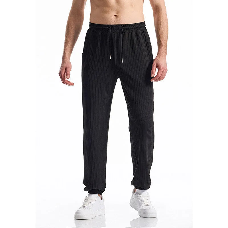 Silky rib fabric baggy straight-leg casual trousers with an elastic drawstring waist in khaki colour.