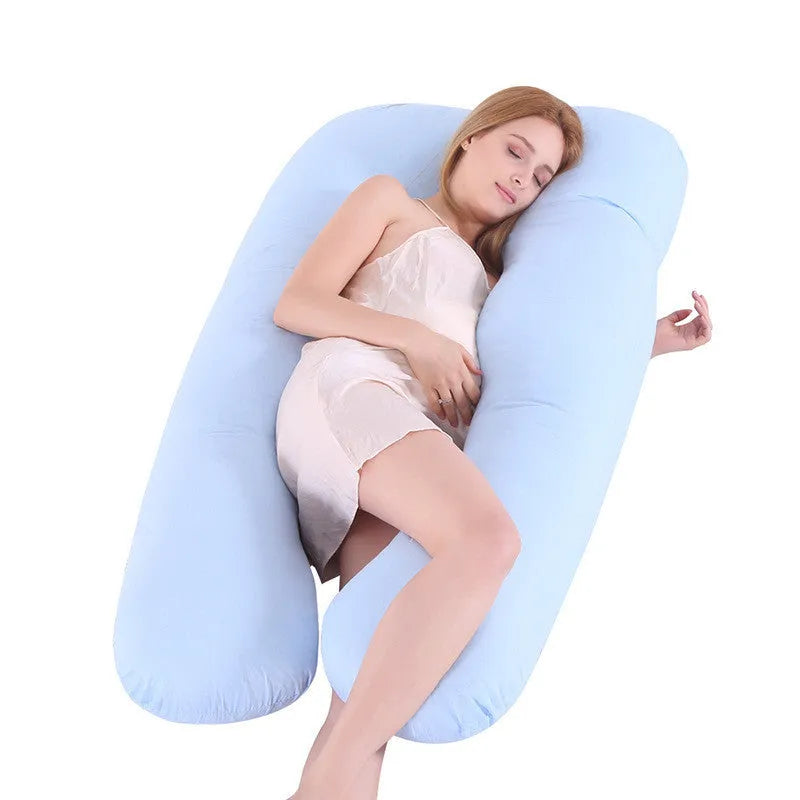 Light blue U-shaped ice silk maternity pillow for pregnancy support on a bed