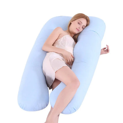 Light blue U-shaped ice silk maternity pillow for pregnancy support on a bed