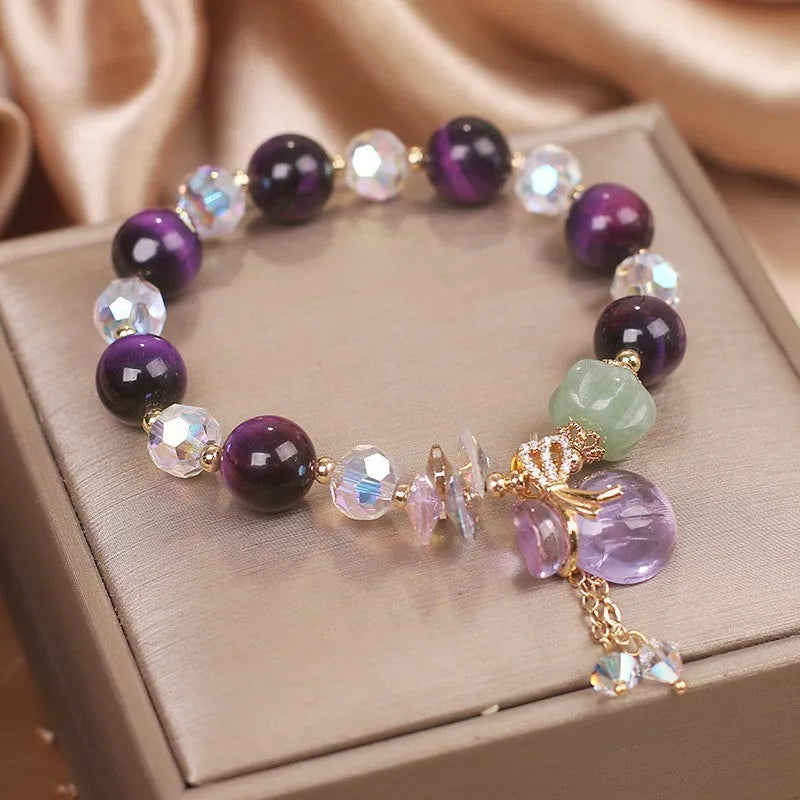 Women's crystal bracelet with purple tigereye money bag pendant and rhinestone decorations