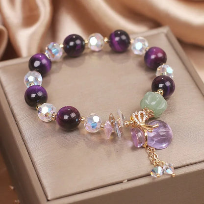 Women's crystal bracelet with purple tigereye money bag pendant and rhinestone decorations