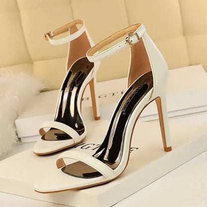 Women's open-toe high heels with an ankle strap and buckle, shown in multiple colours.