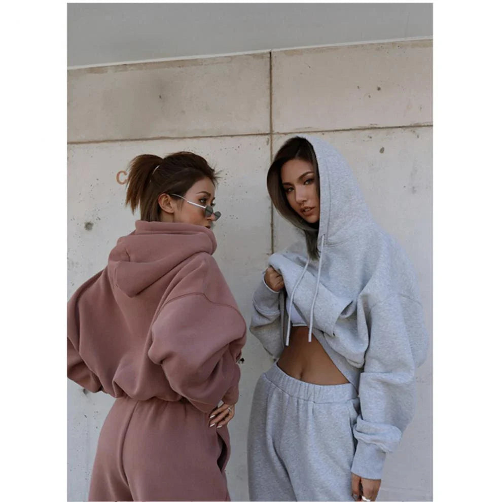 Women's polyester hoodie jacket and sports pants set in various colors for casual and athletic wear