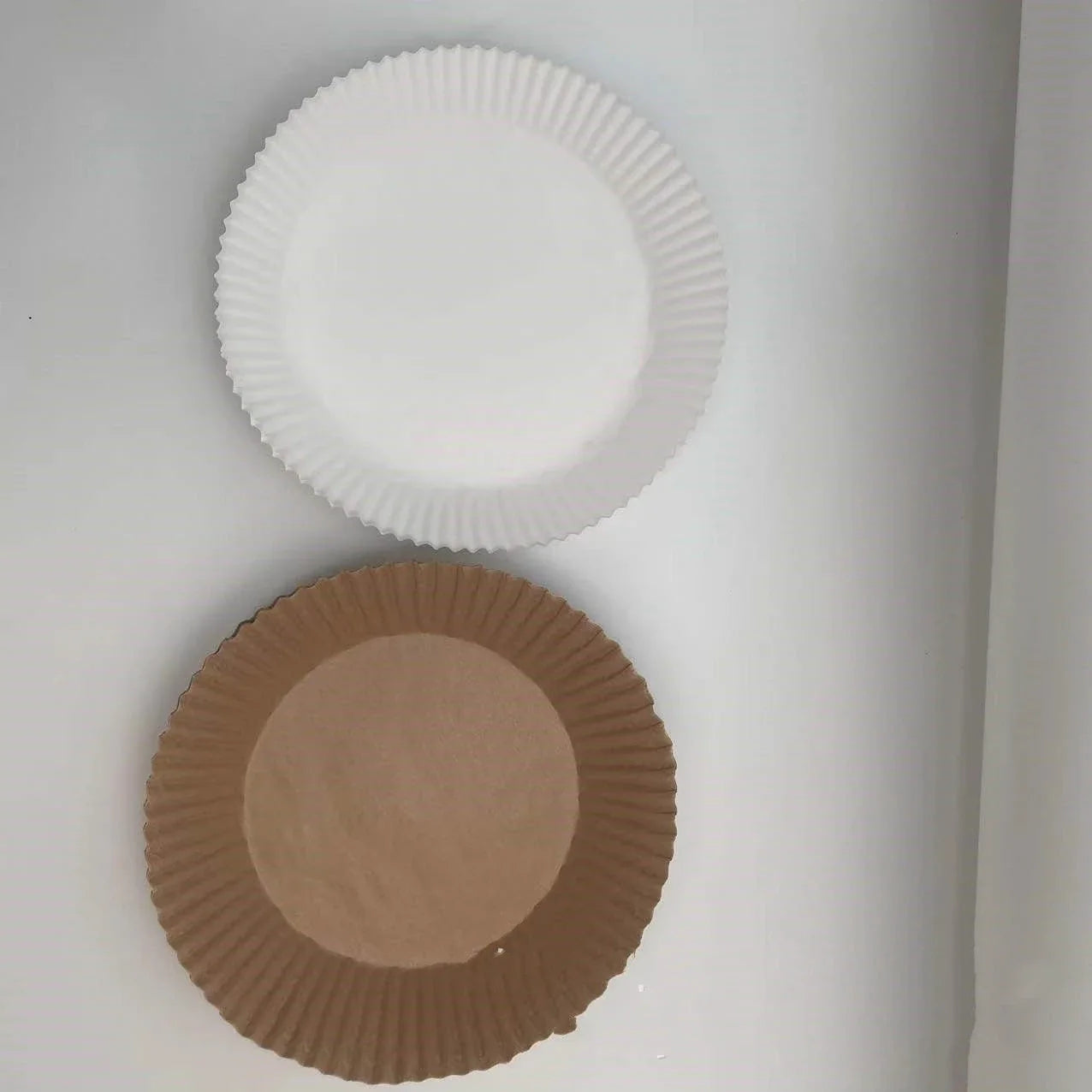 Disposable air fryer liners made from high-quality parchment paper, designed to keep your air fryer clean and your meals healthy