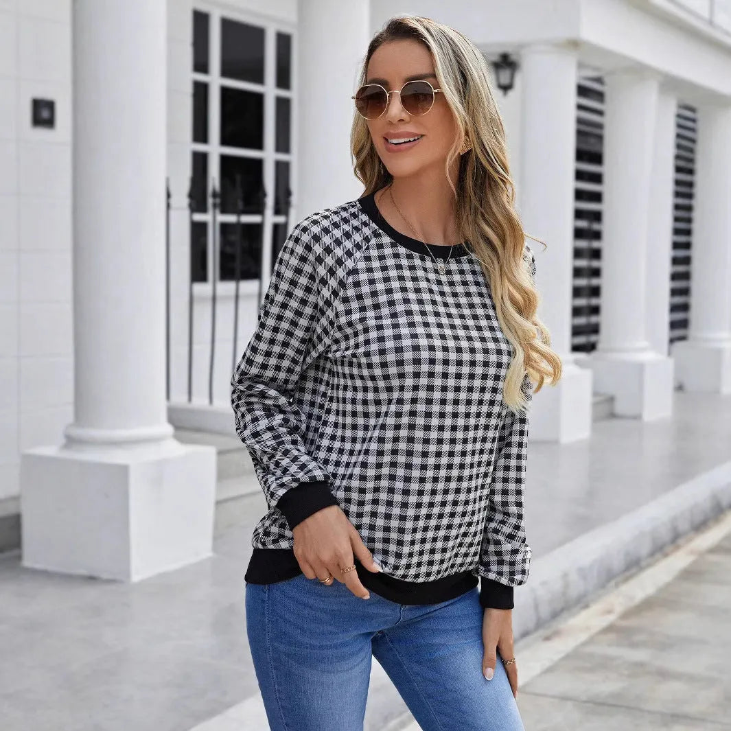 Black plaid pullover sweater with striped pattern and long sleeves, showing printing detail on polyester fabric