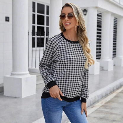Black plaid pullover sweater with striped pattern and long sleeves, showing printing detail on polyester fabric