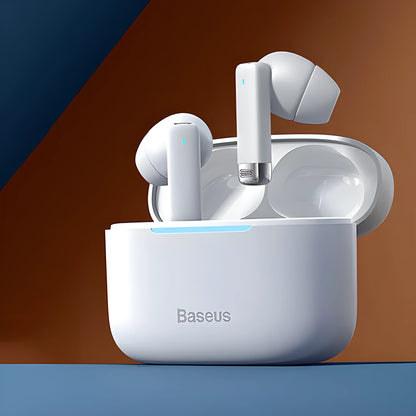 Pearl White and Obsidian Black true wireless earbuds with charging case on a table.