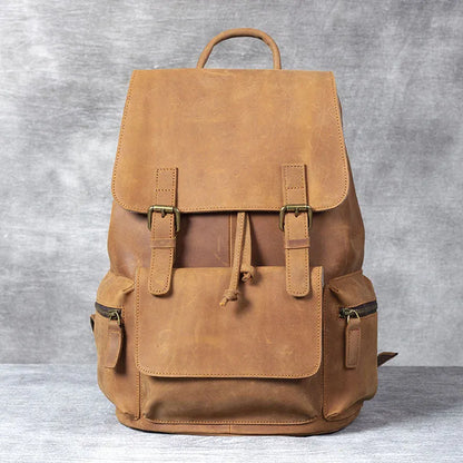 Retro brown genuine cowhide leather backpack with shoulder straps and a top handle.