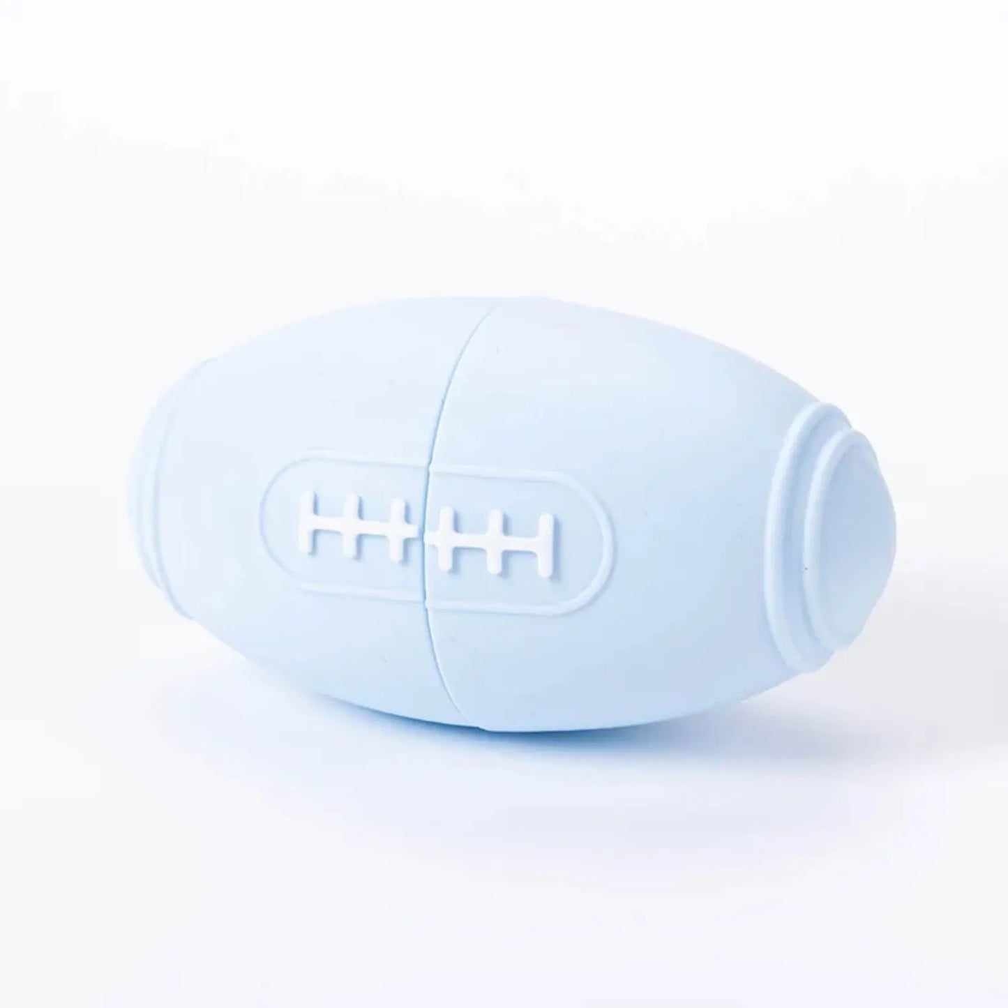 Blue silicone rugby ball dog toy with ridges and hollow centre for treats