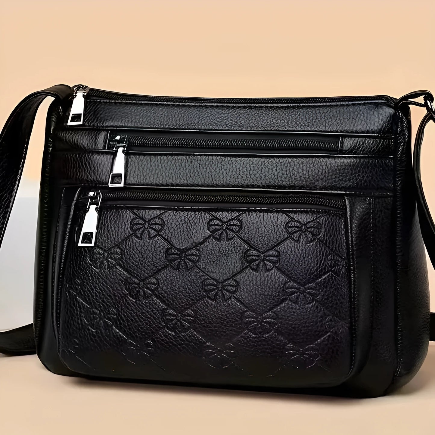 Butterfly black women's crossbody bag with horizontal square shape, slit pocket, and embossed PU detail