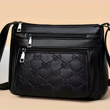 Butterfly black women's crossbody bag with horizontal square shape, slit pocket, and embossed PU detail