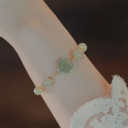 Women's bracelet with Hetian jade rose flower design and 14K gold gilding