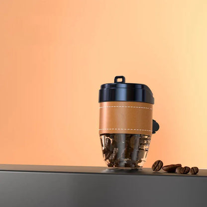 Brown plastic coffee cup-shaped solid car air freshener on a car dashboard.