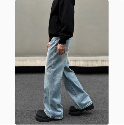 Men's blue straight leg jeans with whisker distressing and flared leg cut
