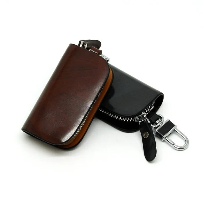Genuine leather car key case with zipper closure showing black and brown colour options