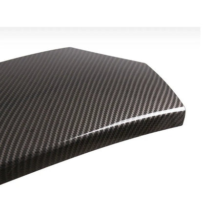 Set of three black ABS armrest box covers with a diagonal carbon fibre weave pattern and polished surface.