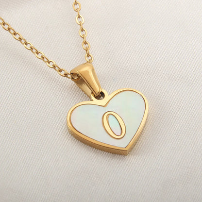 Gold-plated heart necklace with white shell pendant showing letter personalisation option