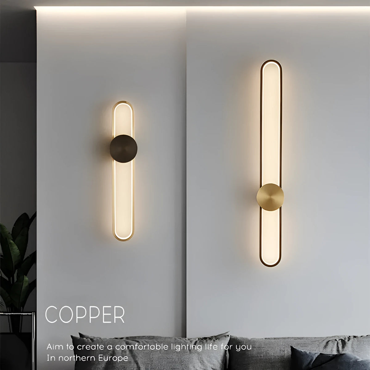 Modern round wall lamp with black iron shade and warm LED light, mounted on a grey wall.