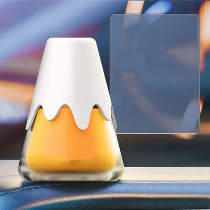 Snow Mountain Cup car air freshener, a purple glass vessel with ceramic paste, placed on a car dashboard