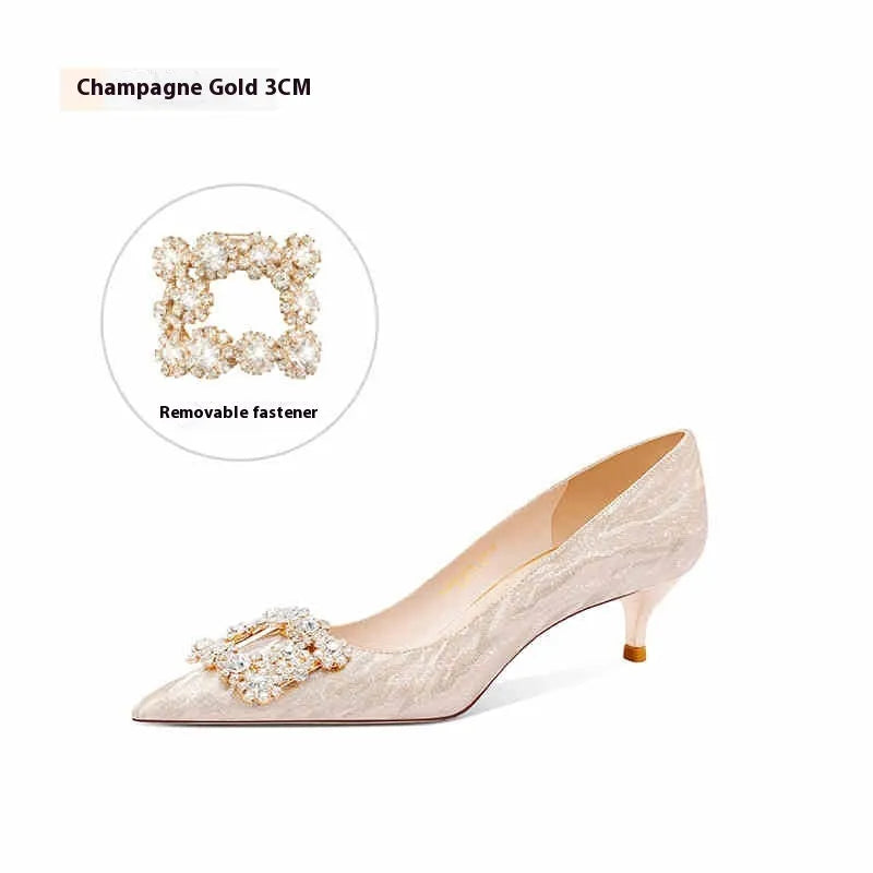 Champagne gold pointed-toe high heel pumps with stiletto heel and rhinestone decoration on the upper.