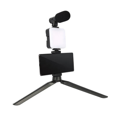 Square LED camera flash with universal hot shoe mount and rotatable head, shown with optional octopus stand tripod.