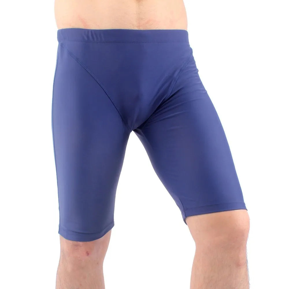 Men's green and navy blue quick-dry swimming trunks with loose fit and anti-embarrassment design