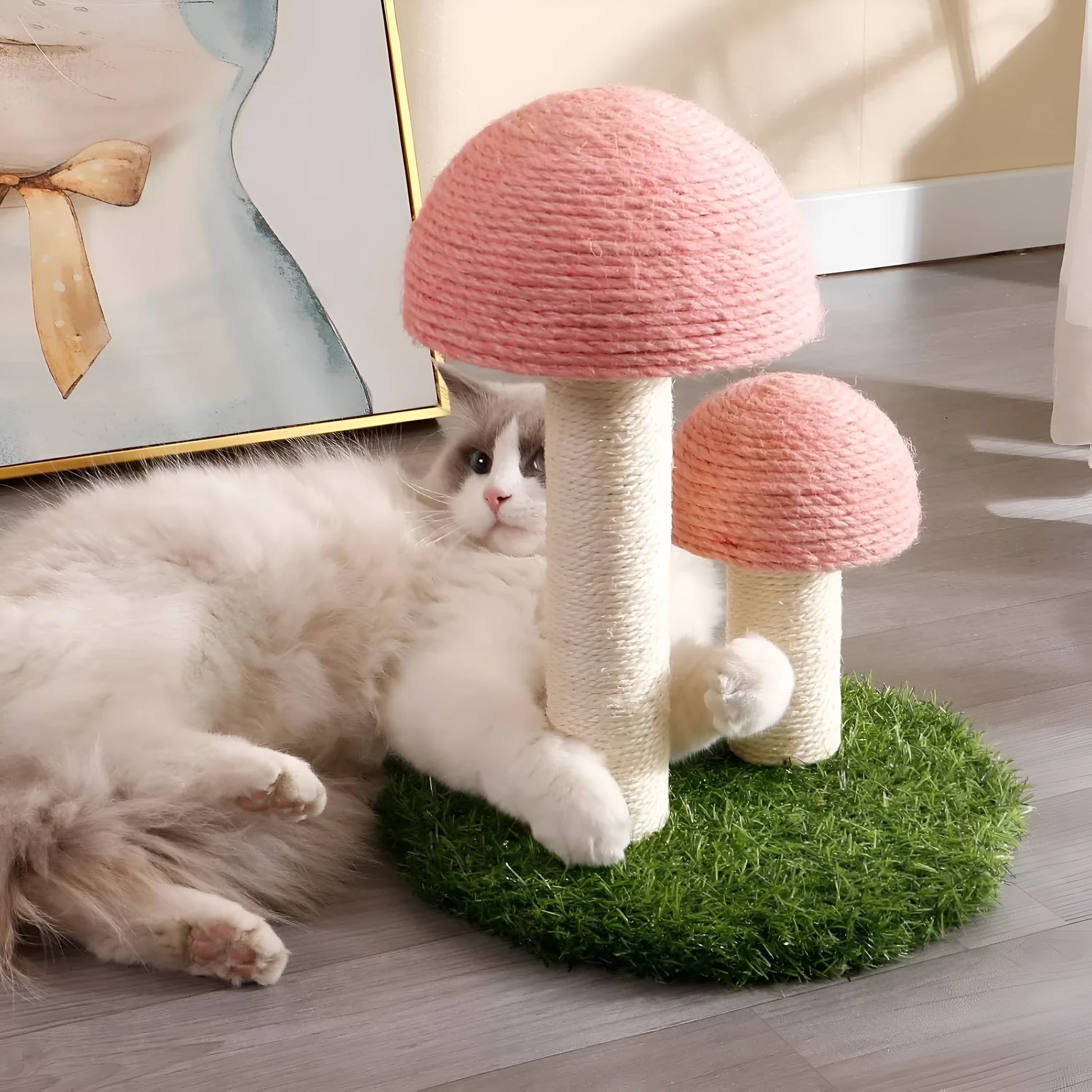 Pink mushroom-shaped cat scratching post with natural sisal caps and pole for small cats.