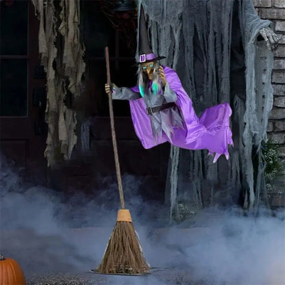 Floating witch Halloween decoration with broom, lifelike scary face, and purple hovering skirt