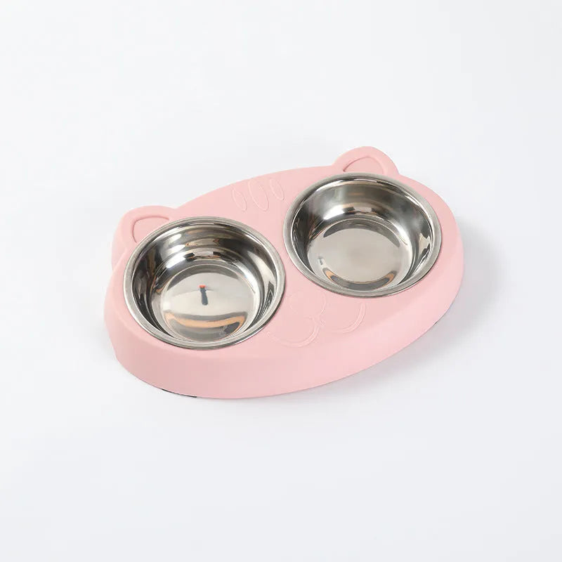 Blue macaron-shaped plastic pet feeder with two food bowls.
