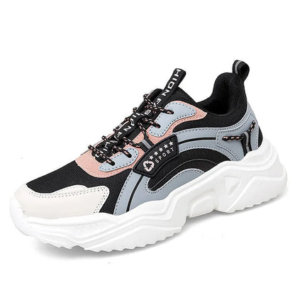 White women's thick-soled casual sports shoes with mesh upper, round toe, and buckle detail.