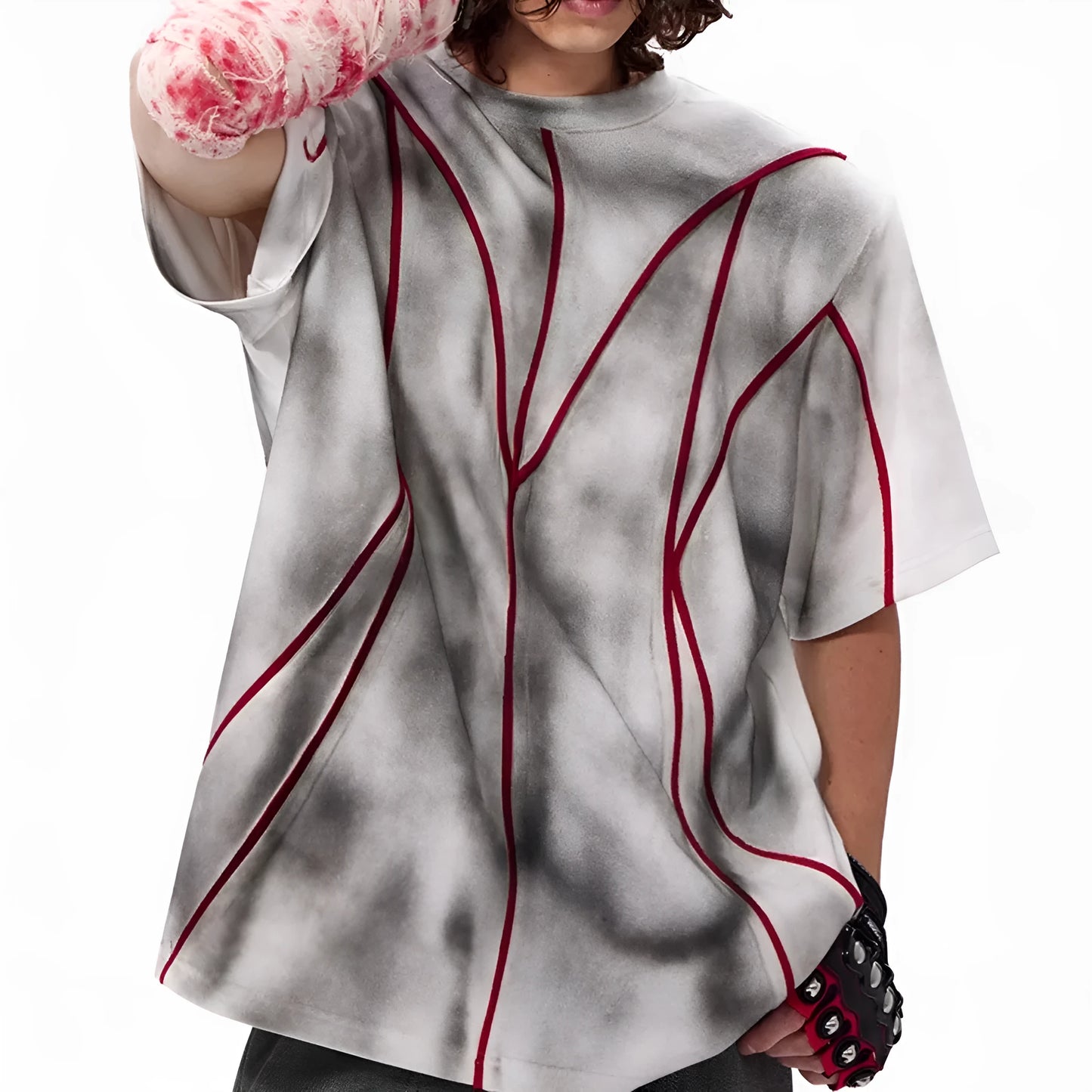 Padded shoulder short sleeve T-shirt with three-dimensional line patchwork detail on a mannequin.