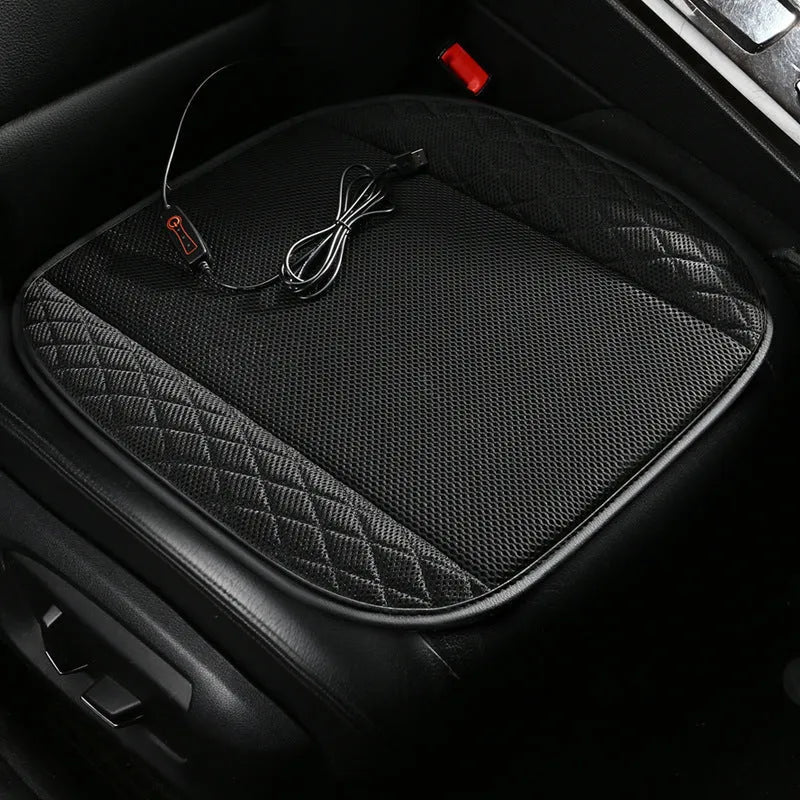 USB ventilated car seat cushion in black suede with visible fan vents, placed on a car seat.