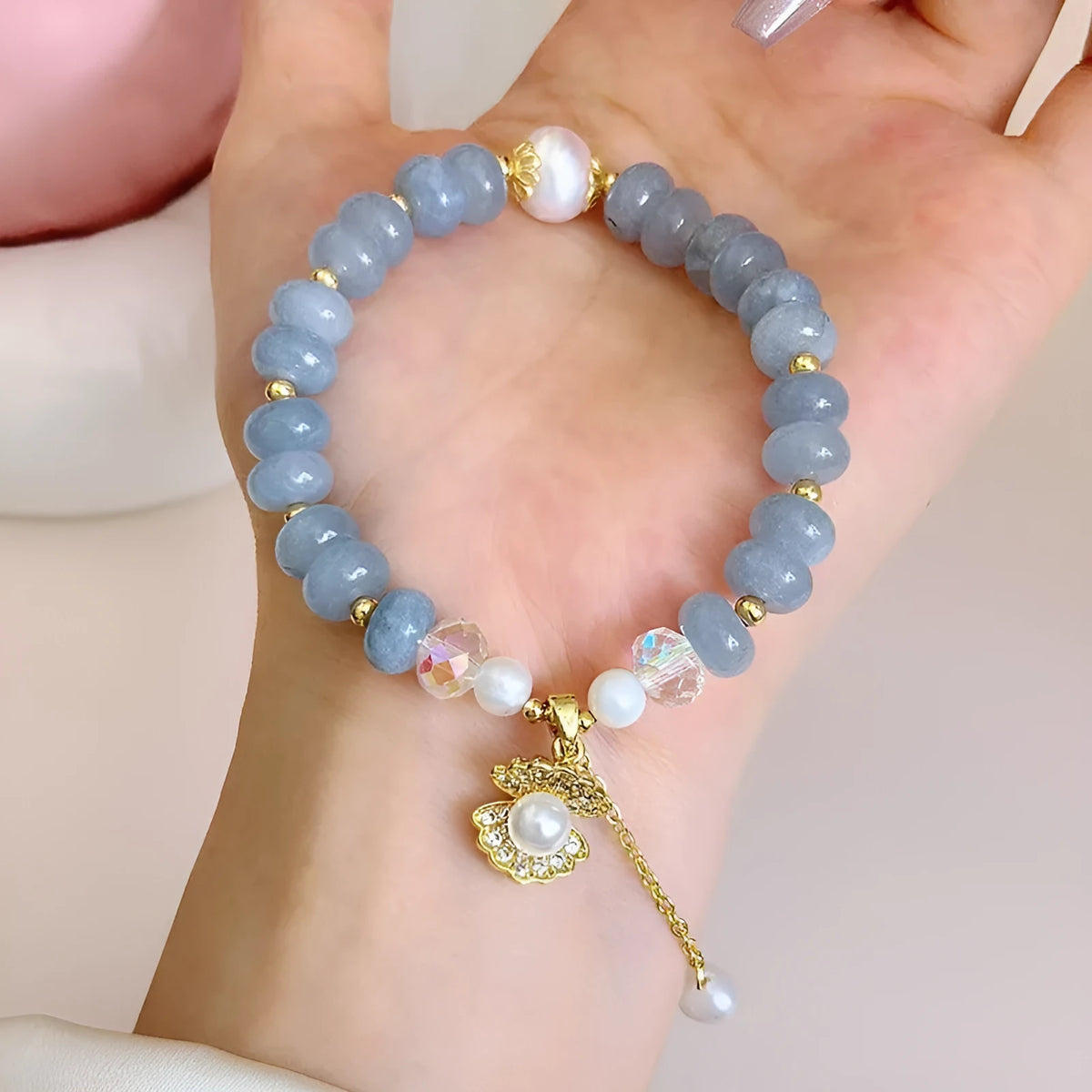Natural aquamarine pearl bracelet with abalone shell charms on adjustable cord