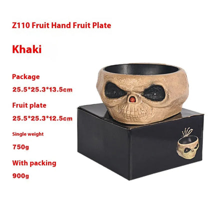 Motion-activated Halloween pumpkin candy bowl with lighted red eyes and skeleton hand in grey colour