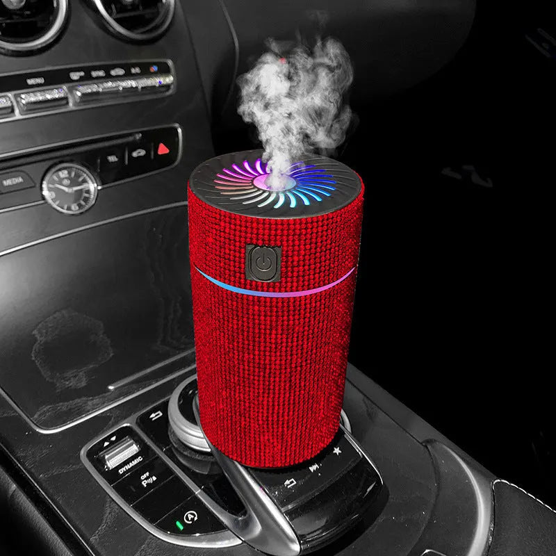 Compact white car air purifier and humidifier unit with USB cable on a car dashboard.