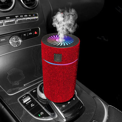 Compact white car air purifier and humidifier unit with USB cable on a car dashboard.