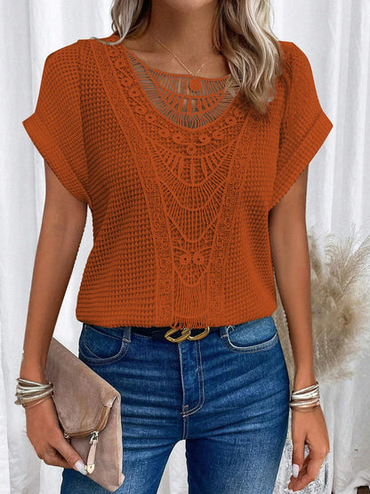 A stylish and comfortable short-sleeve t-shirt for women, featuring a unique hollowed-out design and breathable polyester fabric.