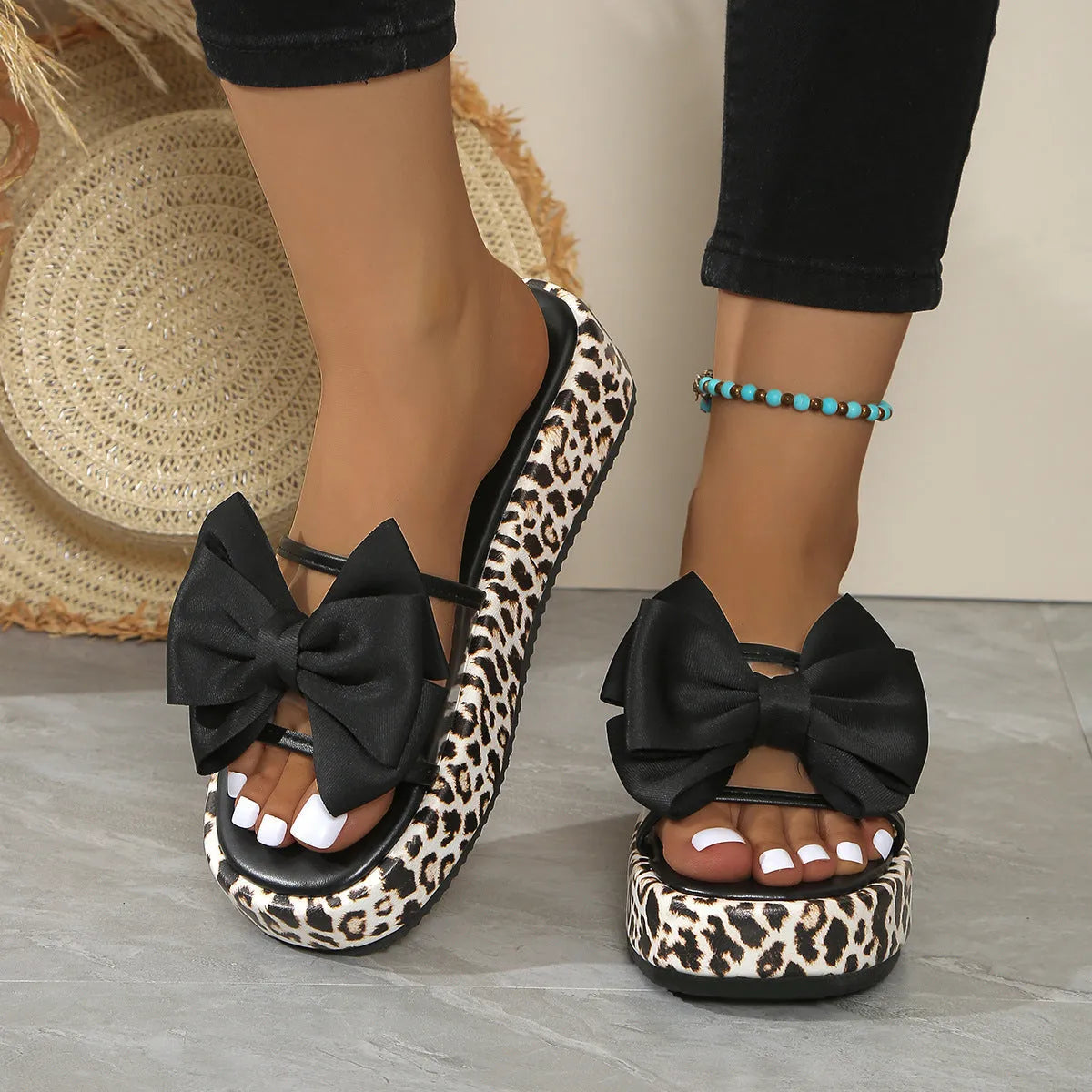 Women's leopard print thick sole beach slippers with round toe and PU upper in black and white options