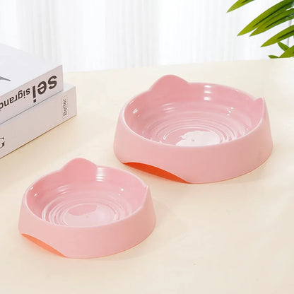 Blue ceramic dog slow feeder bowl with raised internal maze pattern for large breed dogs on a wooden floor.