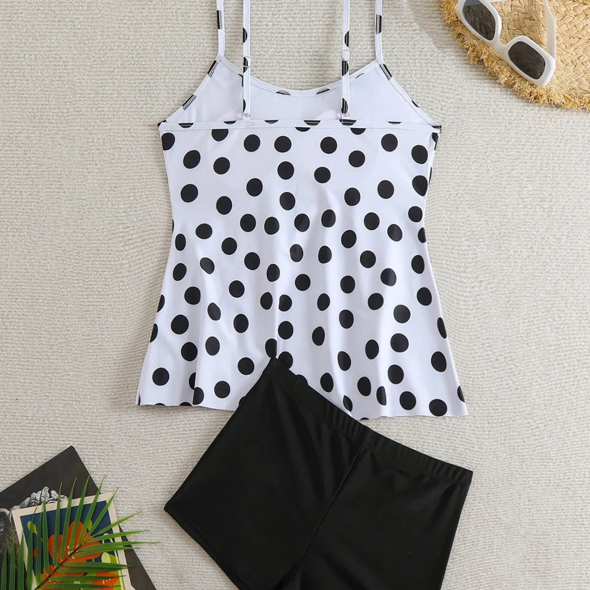 Women's black and white split swimsuit with double-shoulder straps and high-waist briefs
