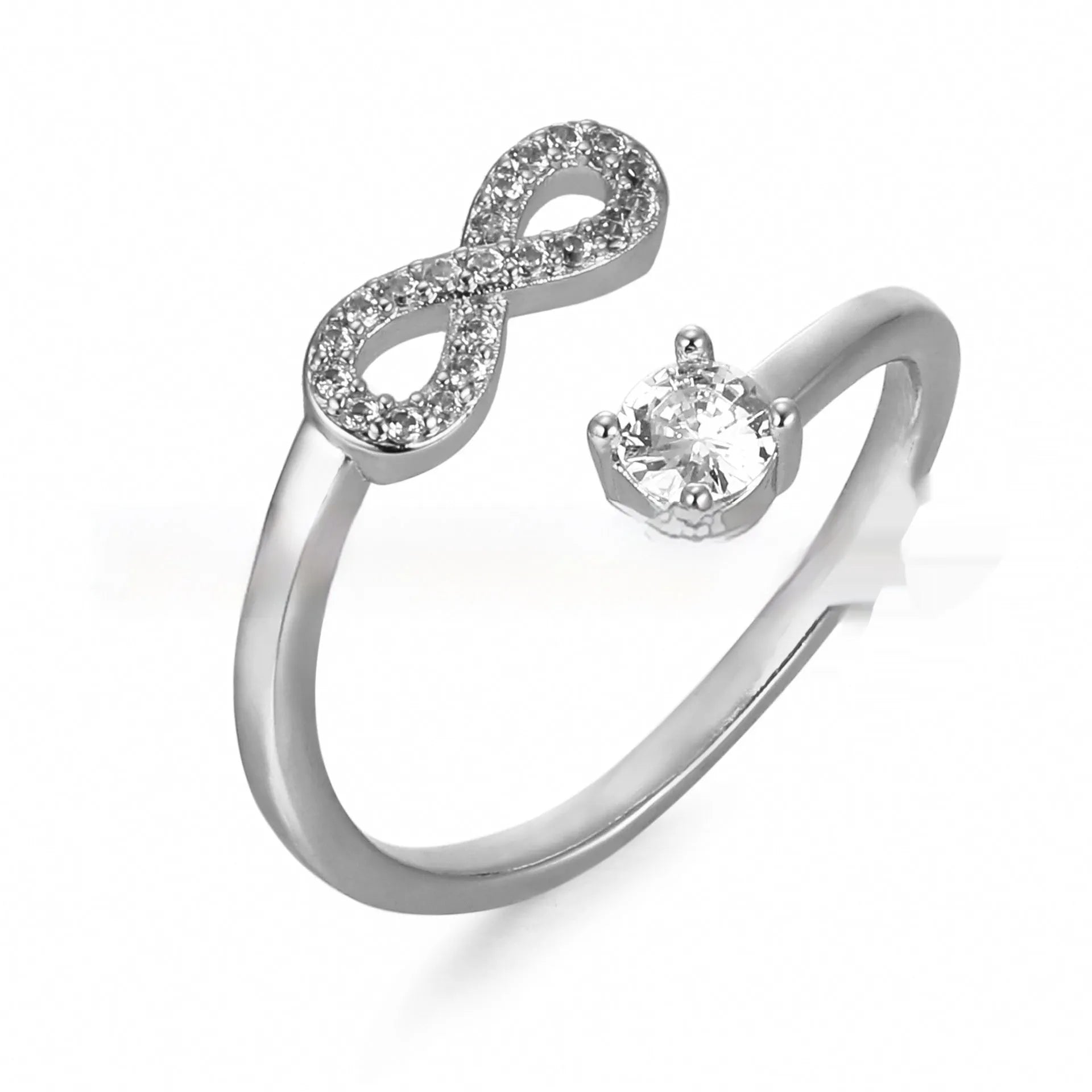 Open geometric ring with a zircon-encrusted letter 'A' in rose gold on a finger.