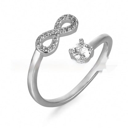 Open geometric ring with a zircon-encrusted letter 'A' in rose gold on a finger.