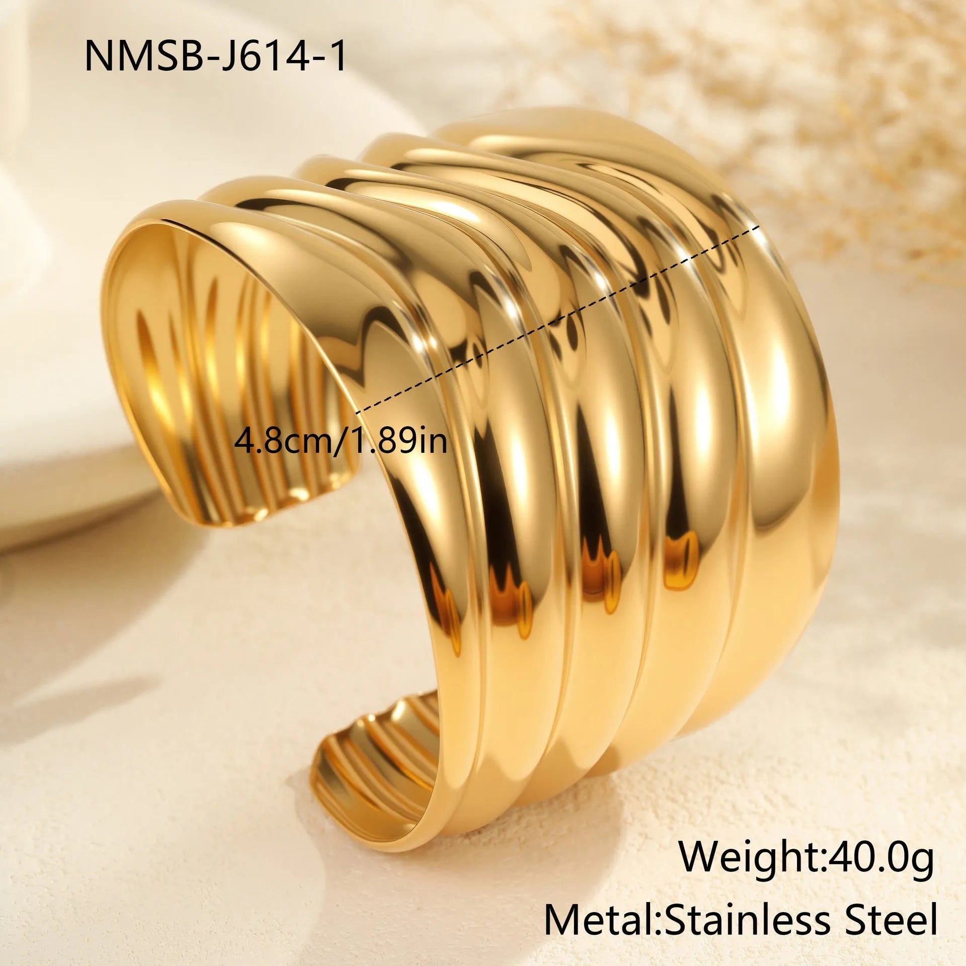 Women's stainless steel bracelet with 18K gold plating featuring exaggerated wide geometric wave design and niche opening