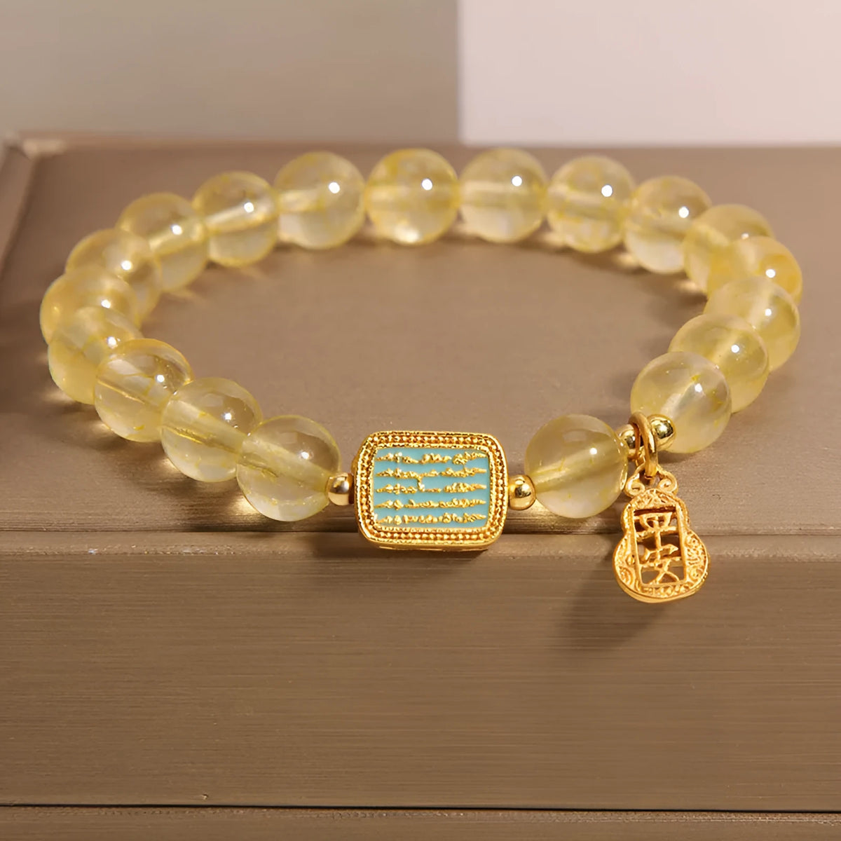Women's natural yellow citrine crystal bracelet with rhinestone detailing.