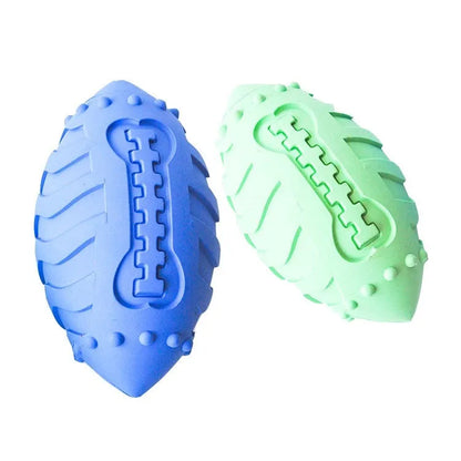 A light green thickened rubber rugby ball dog chew toy on a plain background.