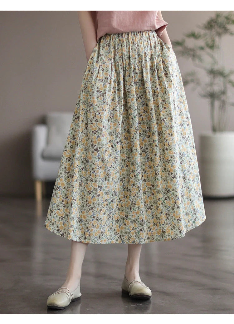 Elegant floral-printed cotton skirt with pleated design, available in yellow and blue flower patterns