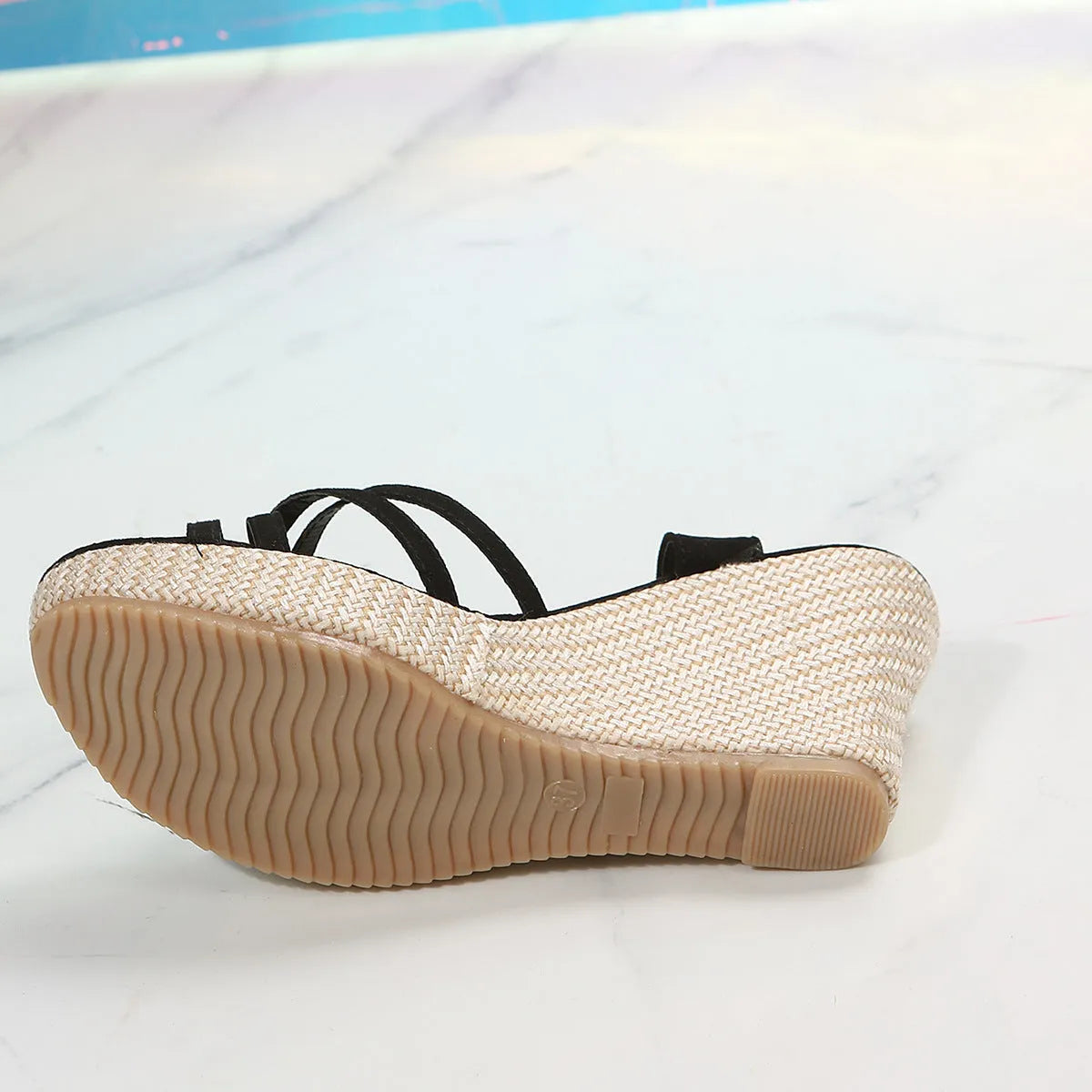 Women's black wedge sandals with a fish mouth toe bracket and fabric upper.