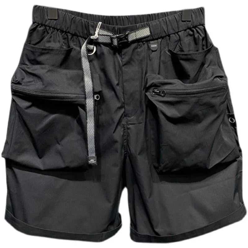 Men's black loose-fit work shorts with multiple pockets showing mid-waist design