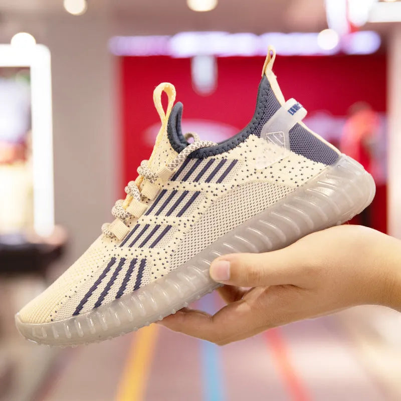 Men's white low-top sports shoes with mesh lining, round toe, and visible stitching on a grey background.