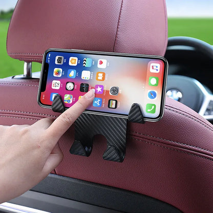 Black ABS plastic car hook and mobile phone holder bracket for rear seat mounting.